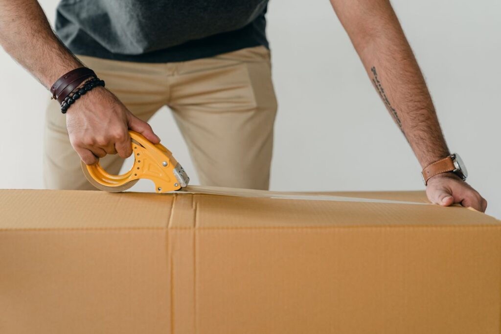 TV being wrapped and boxed for safe transport during a move