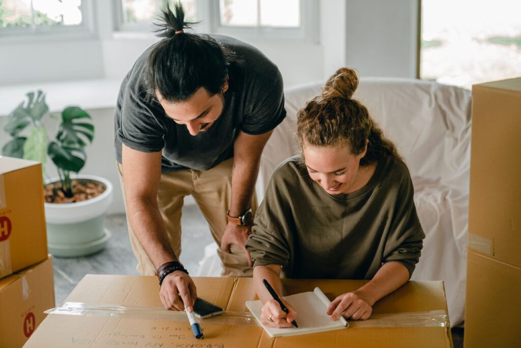 Couple settling into their new home surrounded by moving boxes