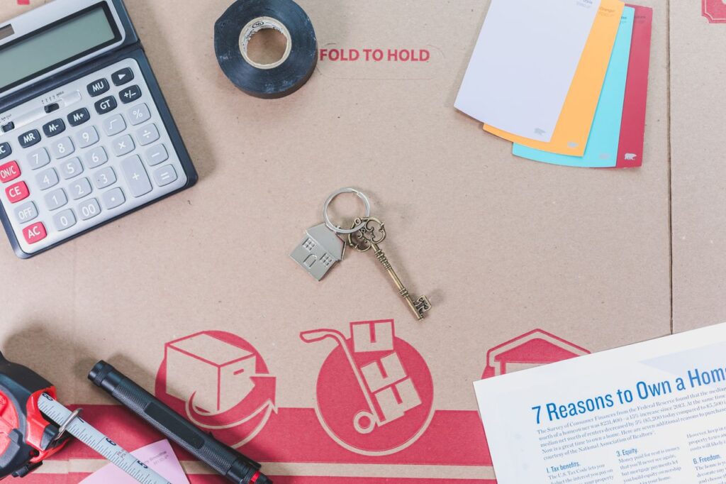 Calculator and paperwork used to estimate moving costs